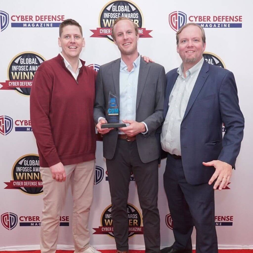 The Realm team accepting the Global InfoSec Award from Cyber Defense Magazine